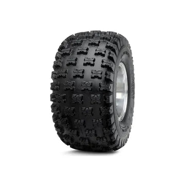 Black off-road tire with prominent tread pattern on a white background