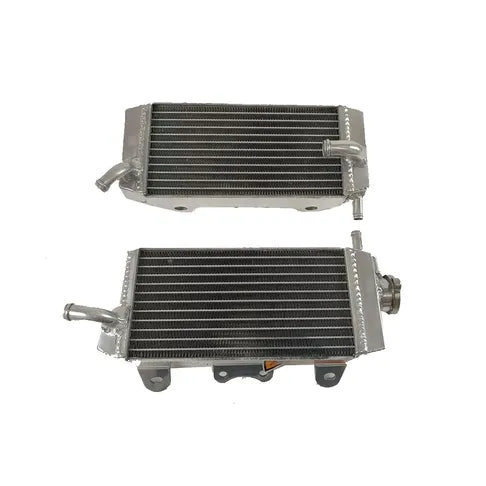 Two metal radiators on a white background