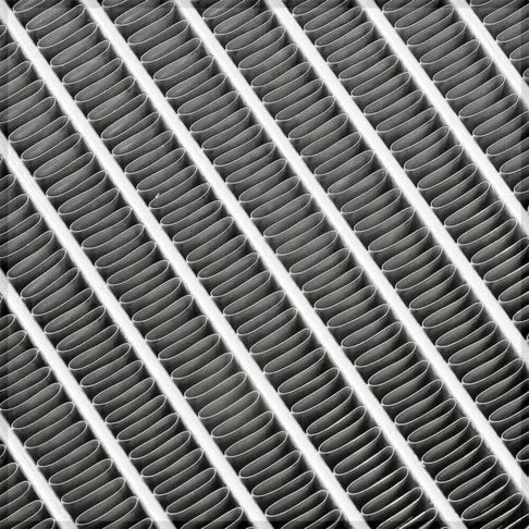 Close-up of a grid with cylindrical elements