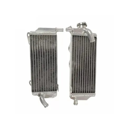 Two metal radiators side by side on a white background