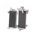 Two metal radiators side by side on a white background