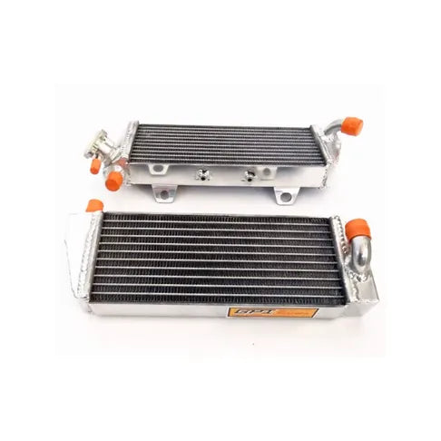 Two metal radiators with orange bolts on a white background