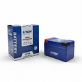 Blue lithium-ion battery with packaging on a white background