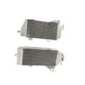Two metal radiators on a white background
