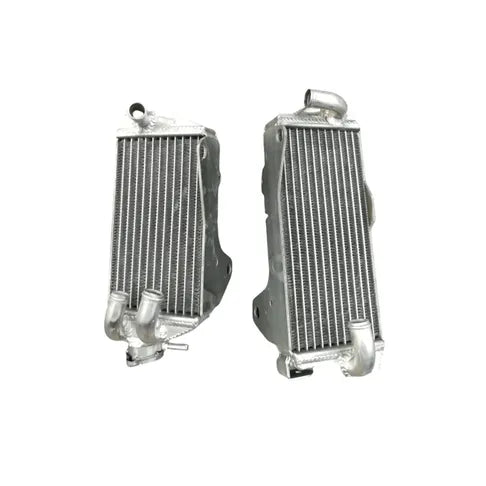 Two silver metal radiators on a white background