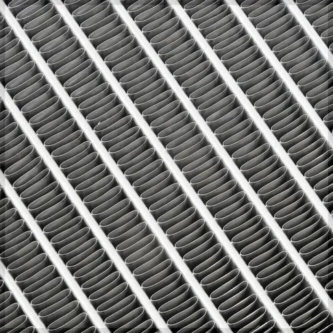 Close-up of a grid with cylindrical elements