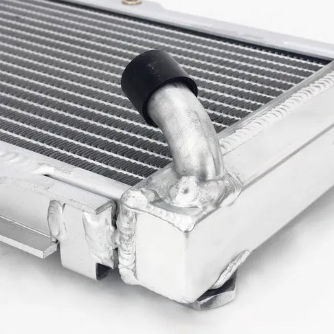 Close-up of a radiator with a black cap on a white background