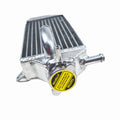 Metallic radiator with a yellow label on a white background