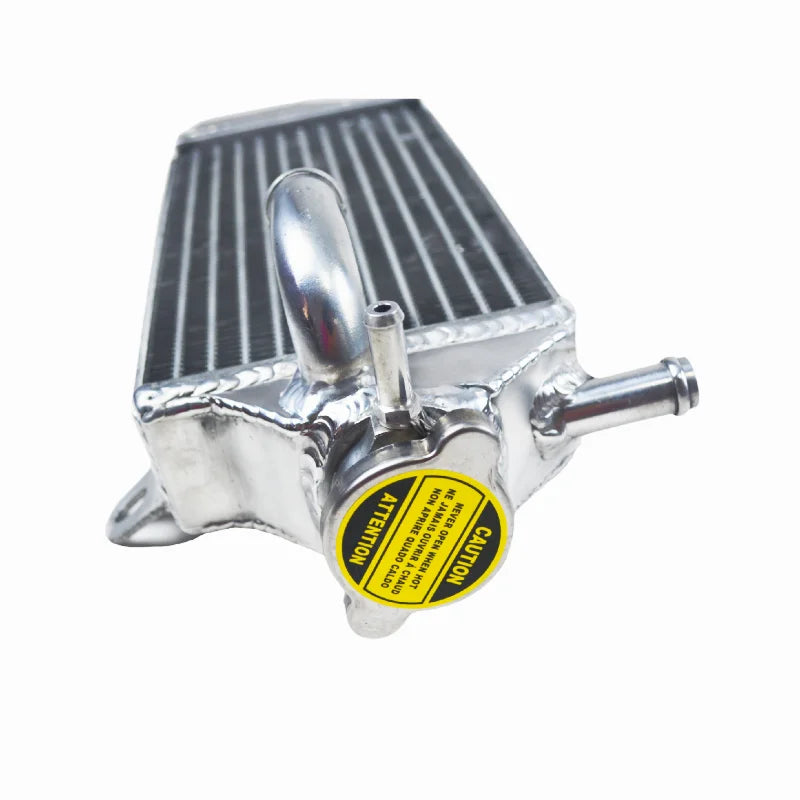 Metallic radiator with a yellow label on a white background