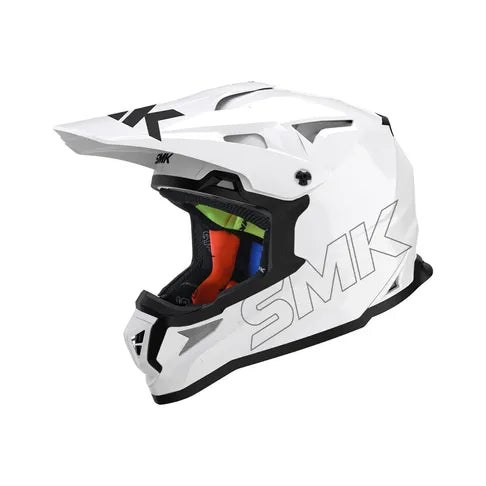 White motocross helmet with black and red interior on a white background