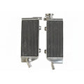 Two metal radiators side by side on a white background