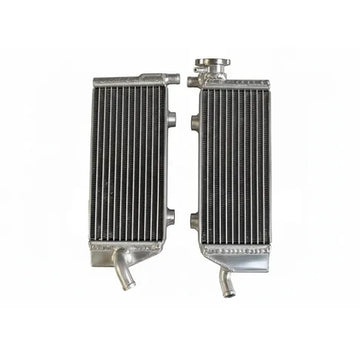 Two metal radiators side by side on a white background
